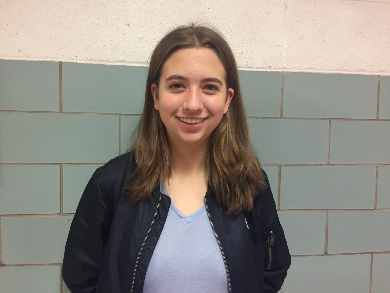 Isabel Siggers poses for a photo in the senior hallway. Siggers turned 18 on Sept. 29, 2018 and is excited to vote in the upcoming midterm election. She has been passionate about voting since she was a child.