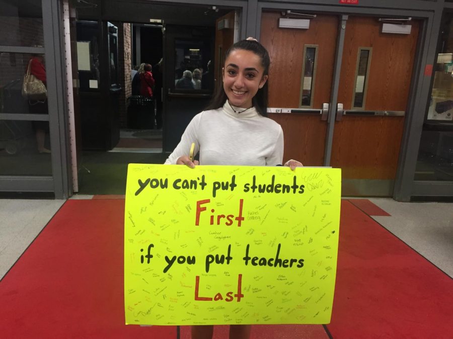 Senior Ariana Dzurenko holds a poster in support of the Glen Rock Teachers Association. In preparation for the BOE meeting, this poster was signed by various GRHS students wishing to show their support for their teachers. 