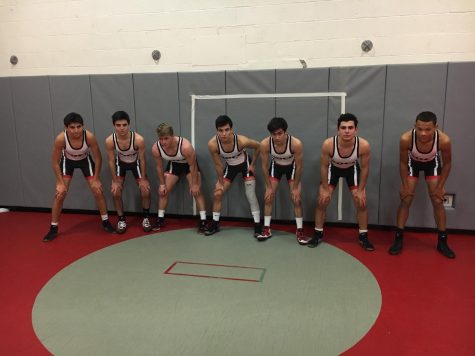 After rumor of roster not having enough athletes, wrestling team starts season
