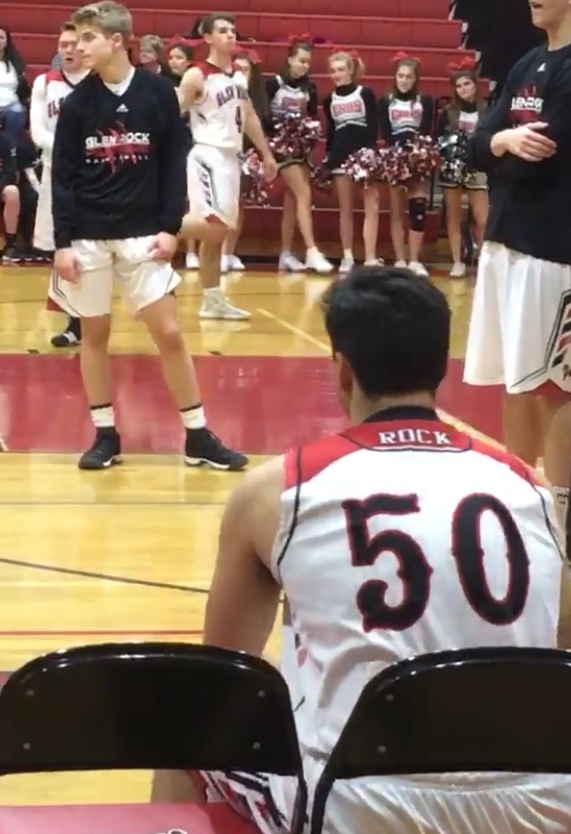 Gabe (50) waiting to hear his name being called to come out on the court to play for Glen Rock.