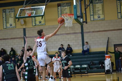 #35 Will McLoughlin soars to the rim to lay the ball in to cut into Pascack Valley’s lead in the fourth quarter. McLoughlin, a junior is also a two year starter, and has stepped into an evener larger roll this year for the Panthers.