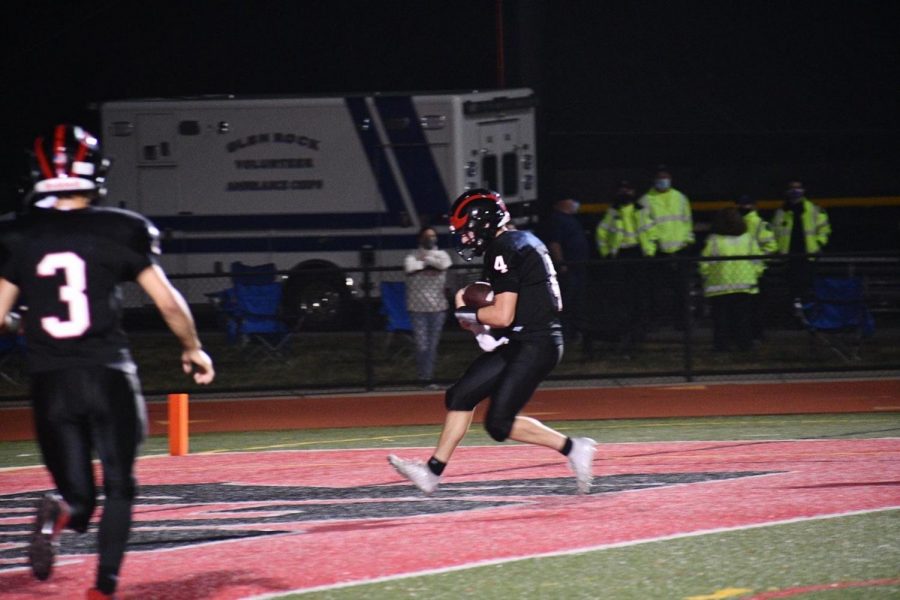 Ty+Scherer%2C+Senior%2C+celebrates+in+the+endzone+following+his+second+rushing+touchdown+in+a+28-6+win+over+Hawthorne+Friday+night