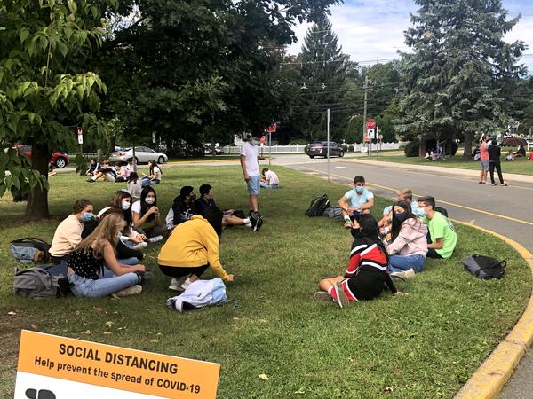 Freshmen meet outside with their mentors during a meeting in October.