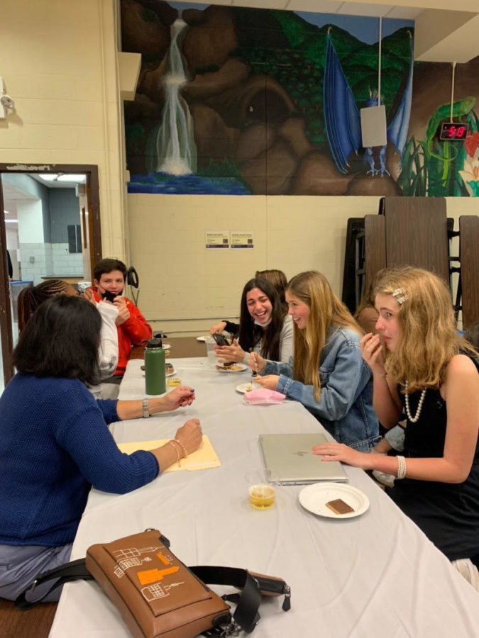 Students enjoy French snacks with Dr. Alswang